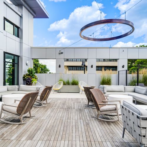 Lounge and soak up the sun on our rooftop pool deck seating.	