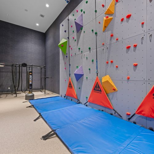 Rock climbing gym with high-intensity training equipment