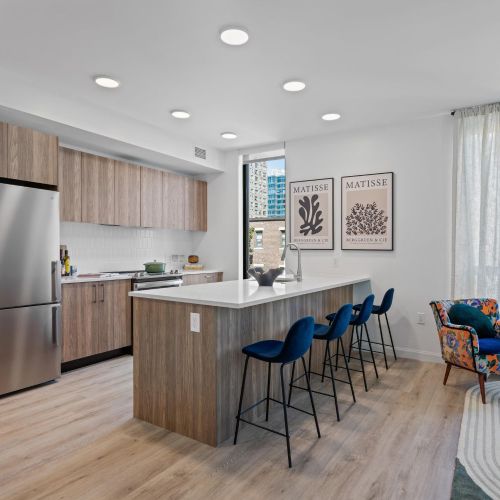 Modern kitchen with bright lighting and sleek appliances.