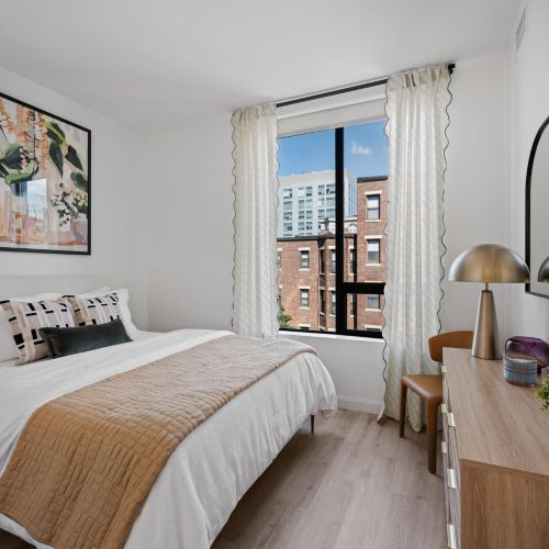 Primary bedroom with a window view.