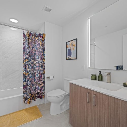 Ensuite bathroom featuring a chic tub.