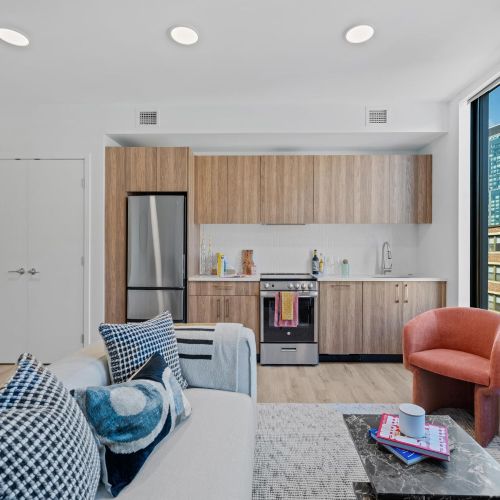 Studio apartment with combined living, bed, and kitchen area.