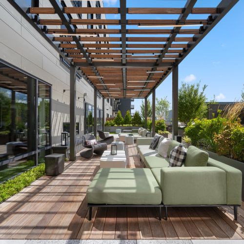 Relax under the stylish canopy of our rooftop lounge, where comfort and views meet.