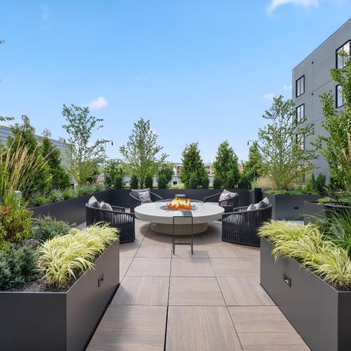 Gather around the cozy firepit on our rooftop deck for warmth and ambiance under the stars.