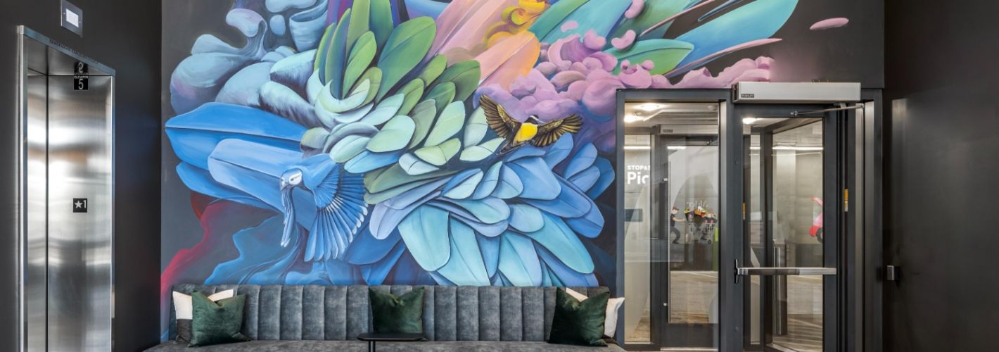 Alder at Allston Yards : Admire the vibrant mural in our lobby, adding a touch of artistic flair to your entrance.