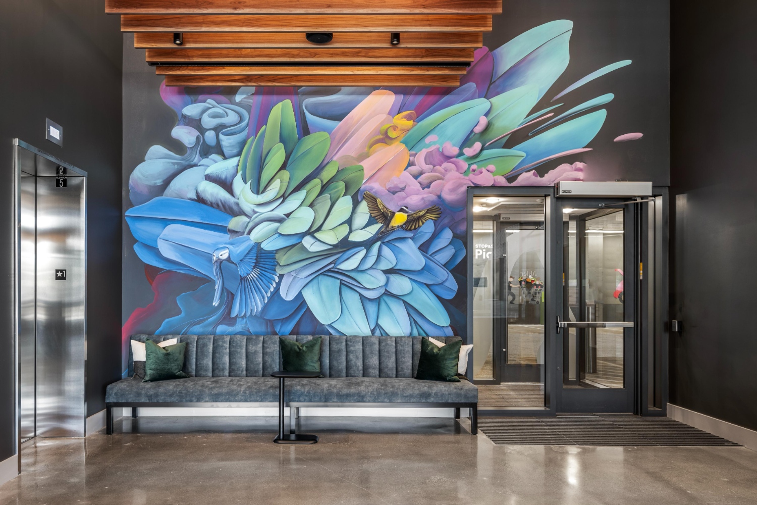 Alder at Allston Yards : Admire the vibrant mural in our lobby, adding a touch of artistic flair to your entrance.