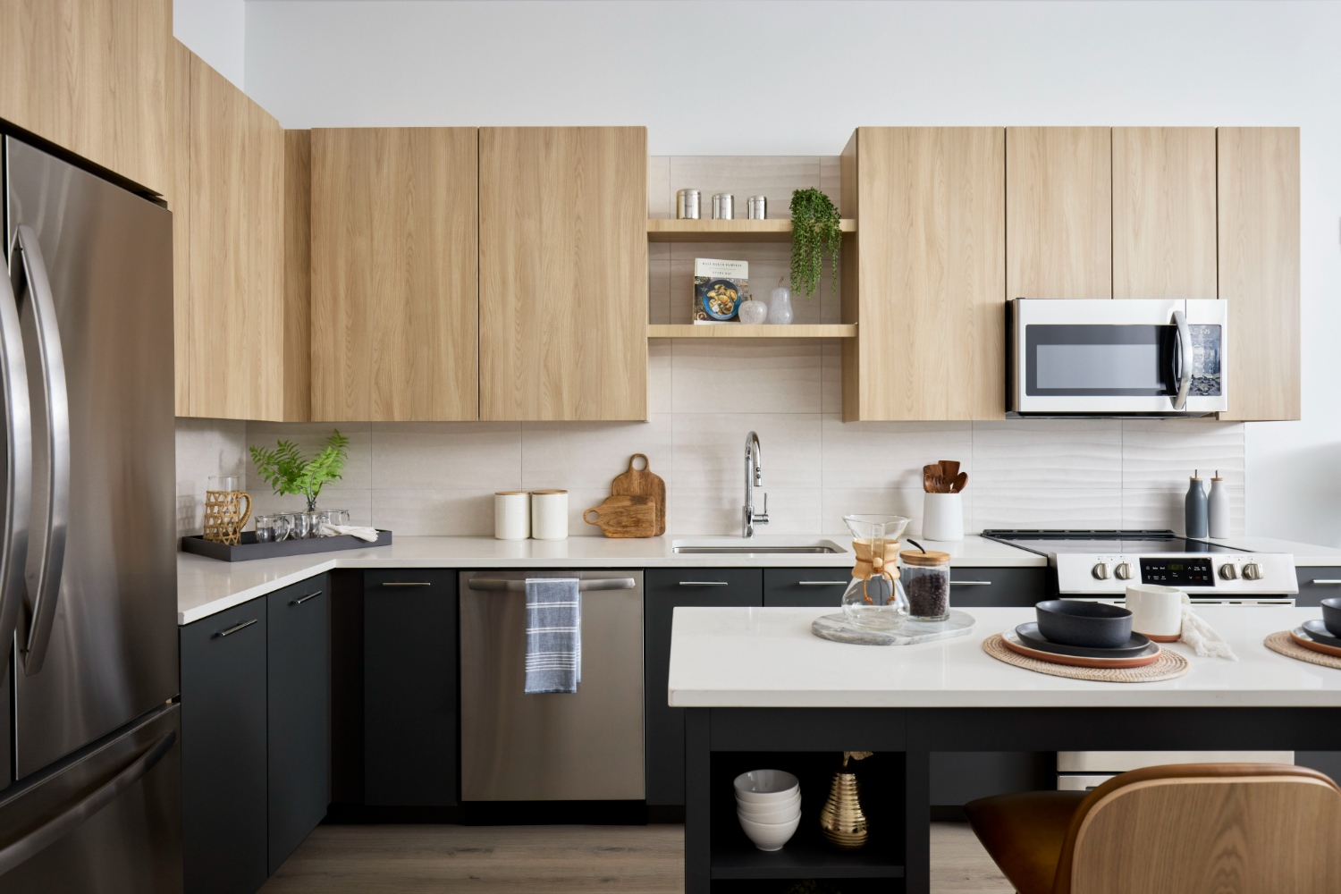 Skymark : Skymark kitchens include quartz countertops, two finish palette options, backsplashes, kitchen islands and stainless steel appliances. 