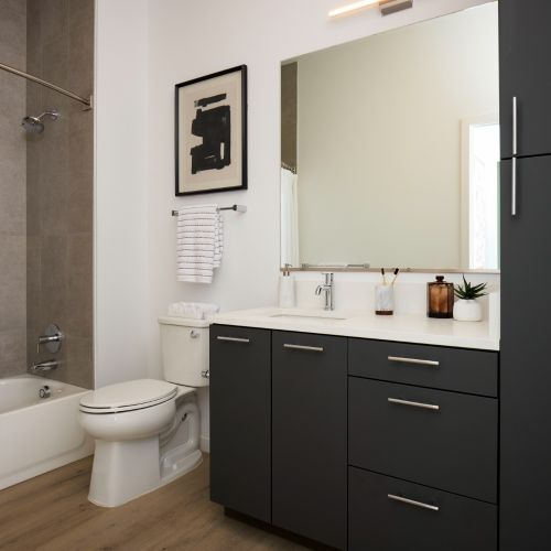 Hotel-inspired bathrooms with ample storage space. 