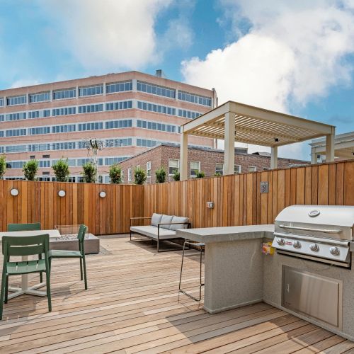Firepit and grill station in community courtyard.	
