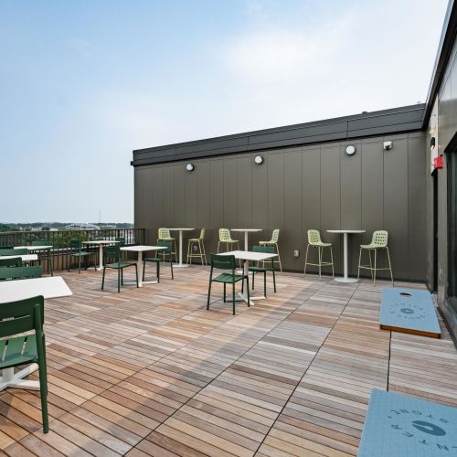 Rooftop communal table with built-in grill.	