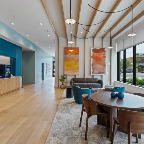 Panoramic city views from rooftop deck seating	