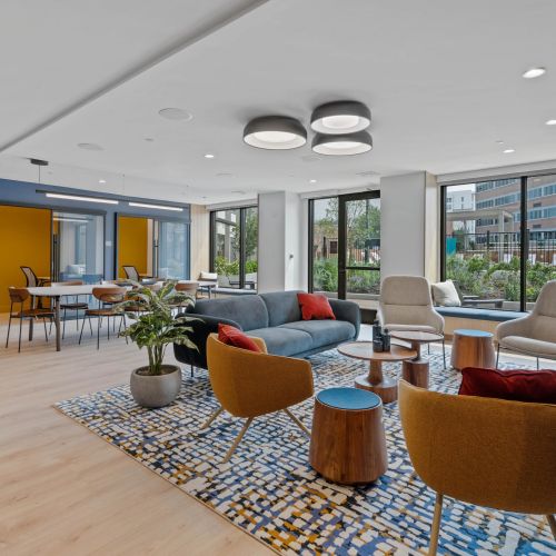 Sleek community kitchen with barstool seating.	