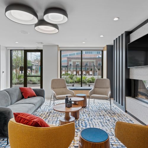 Lounge area with flat-screen TV and entertainment corner.	