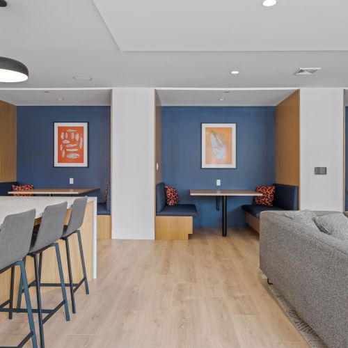 Sectional seating with big screen TV.	