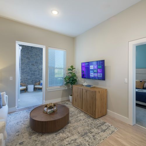 Atlee Square living room with patio entrance 