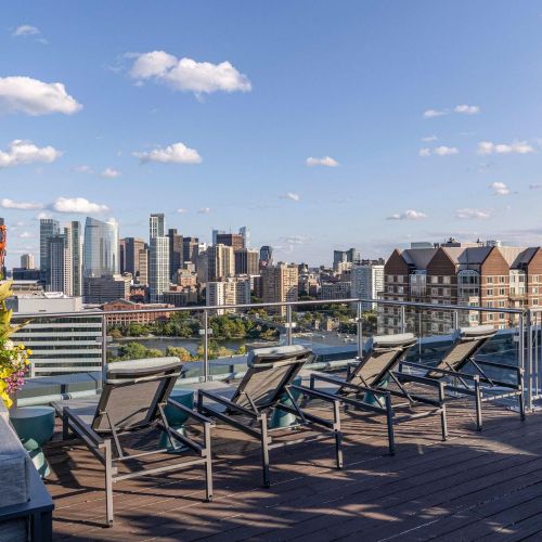 Rooftop deck with sun loungers.