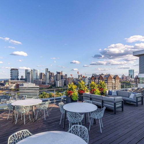 Rooftop deck lounge seating with city view, second angle.
