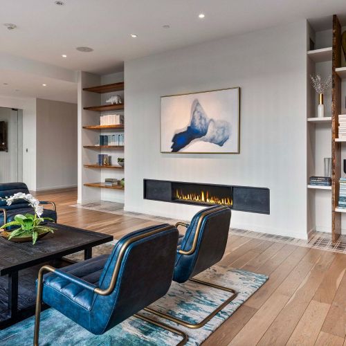 Fireplace in resident lounge, second angle.