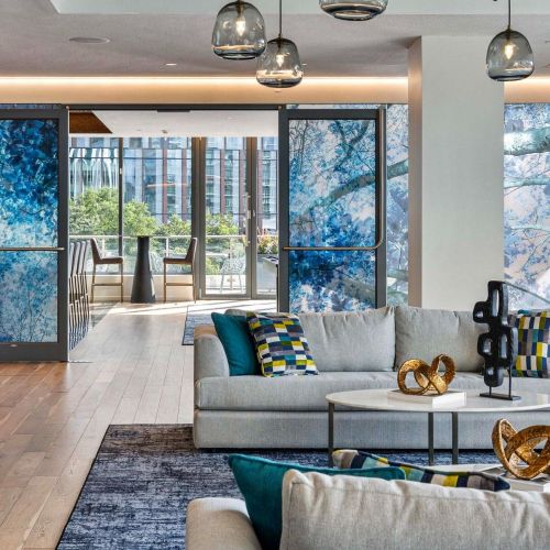 Rooftop lounge with hanging light fixtures.