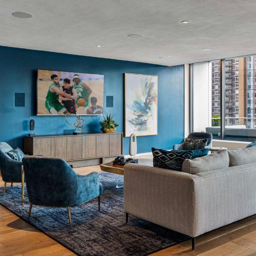 Rooftop lounge seating with TV.