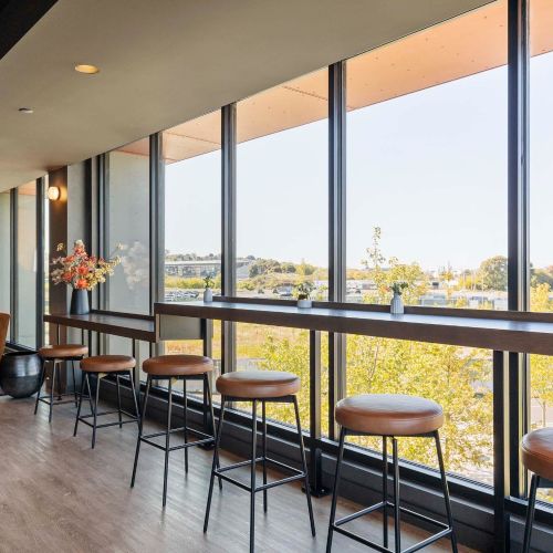 Rooftop lounge with TV for entertainment.