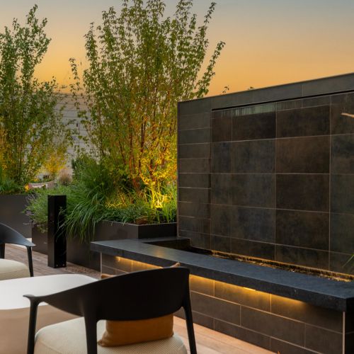 A peaceful moment in the courtyard, where the sunset and water features create a calming atmosphere.	