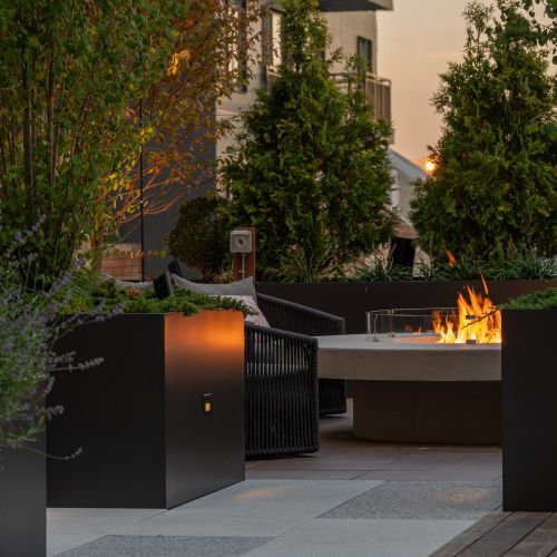 As the sun sets, the firepit nook provides the perfect space for cozy gatherings and evening relaxation.	