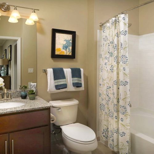 It's a thoughtful blend of form and function with granite vanity tops and tile floors in bathrooms. 	