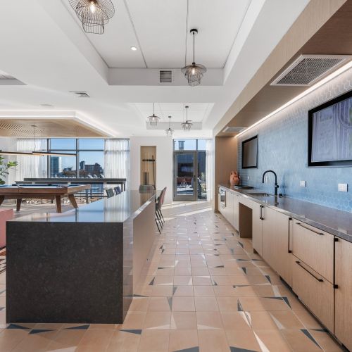 Rooftop community kitchen for hosting and dining.	