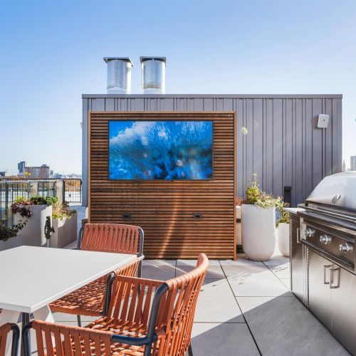 Grill and gather in inviting rooftop dining spaces.	