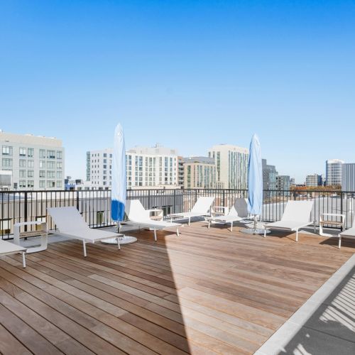 Cozy rooftop sectional seating with friends.	