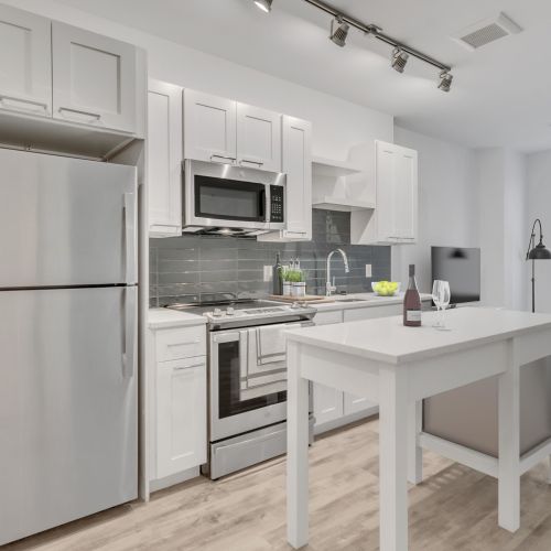 Open kitchens in Margaux's one bedroom apartment homes.	