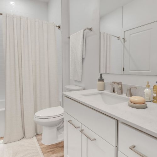 Bright bathrooms with plenty of counter space.	