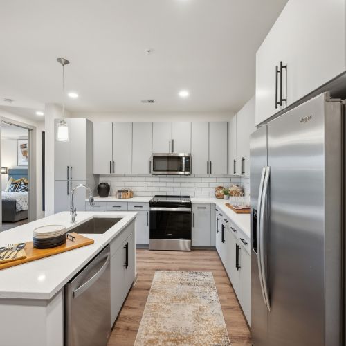 Aura Fifty4 : Flat front kitchen cabinets with 42” uppers and tile backsplash	