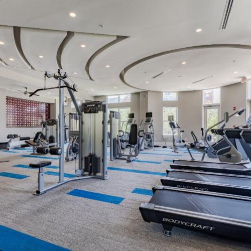 Photo of open fitness area that features bikes and other workout equipment