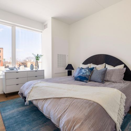 Bright bedroom with neutral decor.