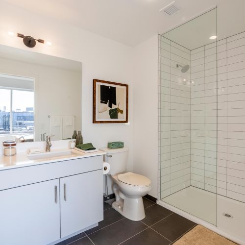 Bathroom with glass shower enclosure.