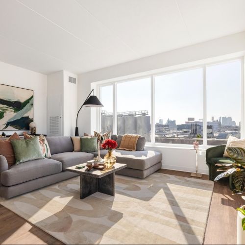 Living room with tall windows.