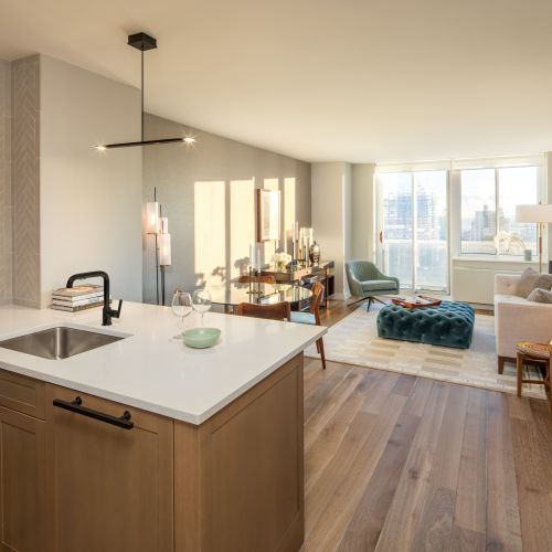 Photo of living room with sky line view from window and dining table