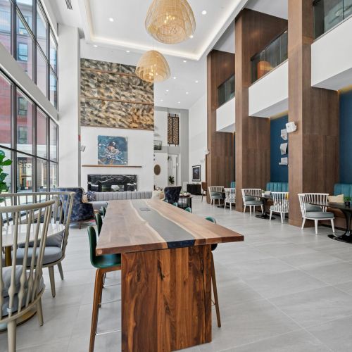 Coworking lounge with private meeting rooms and open booths