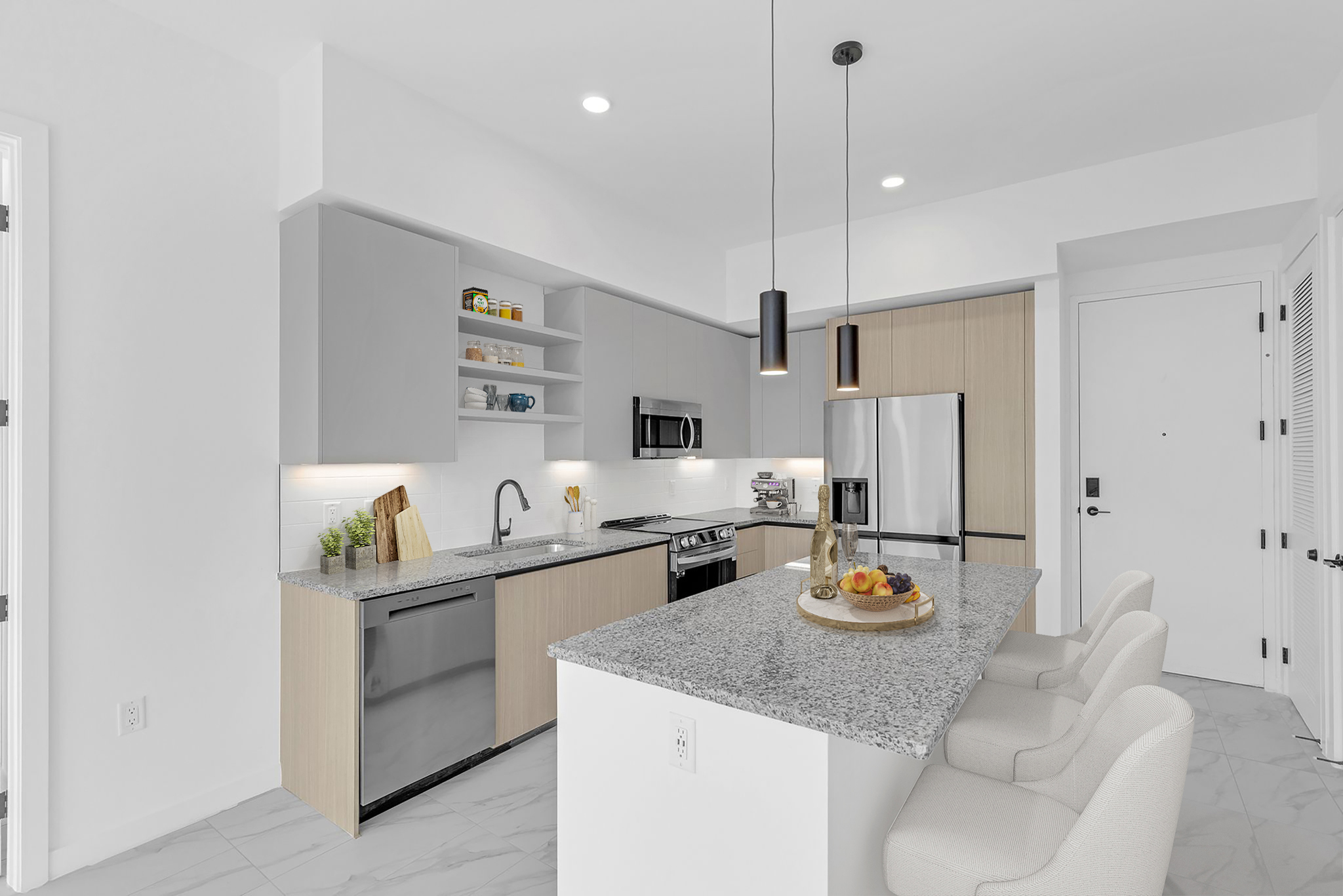 Sleek kitchens with two-tone cabinetry, granite countertops, stainless steel appliances