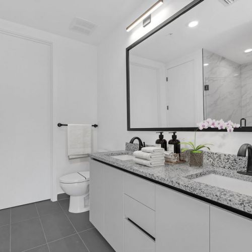 Bathrooms feature granite countertops, under-mount sinks