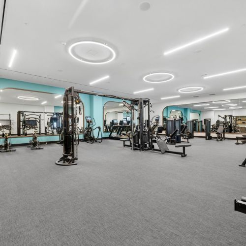Fitness center with strength, cardio, fitness studios, hydration station, and outdoor activity lounge