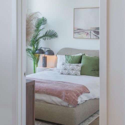 Bedroom entrance with window view.