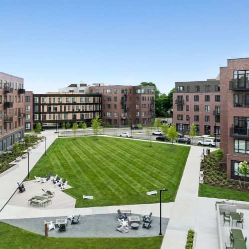 Gather around glowing fire pits in this beautifully landscaped courtyard.