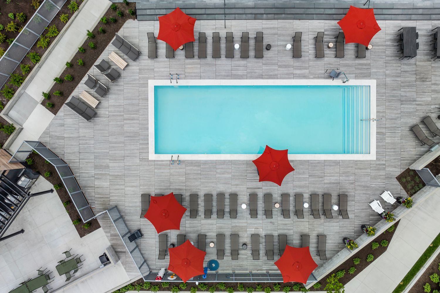Ashlar Park : A stunning aerial view of the sparkling outdoor pool and its relaxing surroundings.