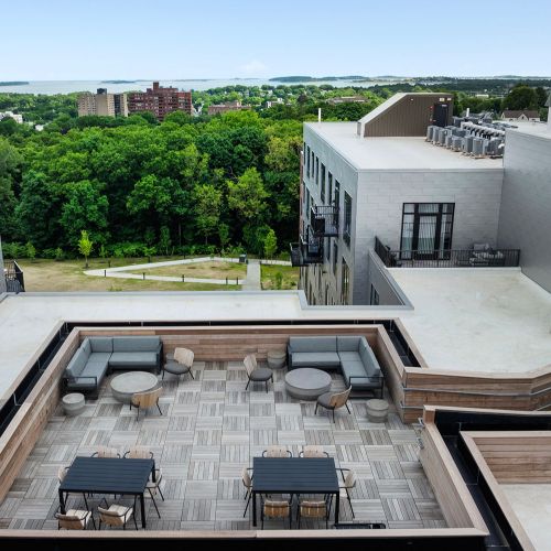 Chic rooftop retreat offering flexible seating and skyline views.