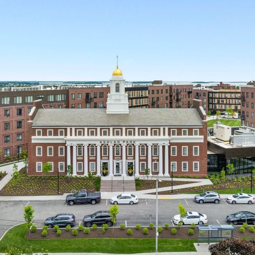 A full-scale perspective of the front entrance and landscaped entryway.