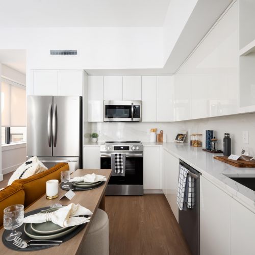 Gourmet kitchens with custom cabinetry and stainless steel appliances