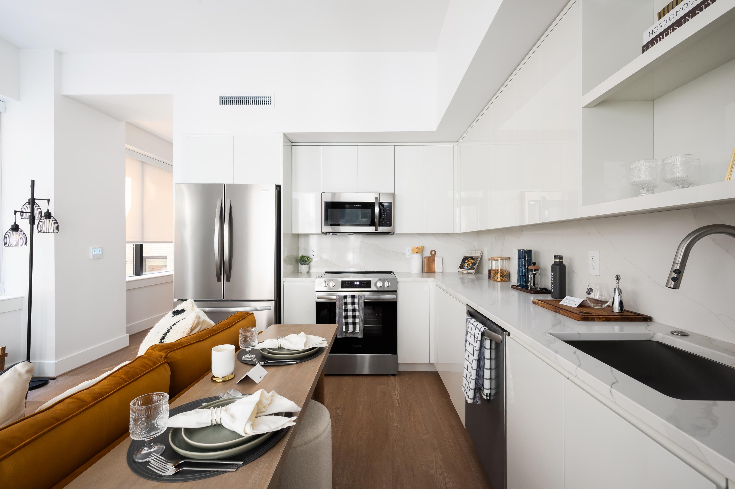 Gourmet kitchens with custom cabinetry and stainless steel appliances